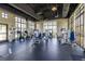 Well-equipped gym featuring cardio machines, weight stations, and ample natural light at 1809 Tropical Palms Cir, Kissimmee, FL 34747