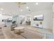 Open-concept living space with a kitchen island, dining area, and comfortable seating arrangement at 1809 Tropical Palms Cir, Kissimmee, FL 34747