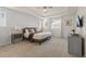 Serene main bedroom with tray ceilings, neutral tones, and ample natural light at 1809 Tropical Palms Cir, Kissimmee, FL 34747