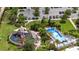 Aerial view of the community water park, featuring a FlowRider, playground, and ample seating at 1809 Tropical Palms Cir, Kissimmee, FL 34747