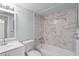 Updated bathroom featuring a shower and bath combination, and modern fixtures at 1908 Lake Atriums Cir # 3, Orlando, FL 32839