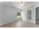 Comfortable bedroom showcasing neutral paint, wood-look flooring, ceiling fan and natural lighting at 1908 Lake Atriums Cir # 3, Orlando, FL 32839