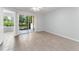 Bright bedroom with sliding glass doors leading to an outdoor patio at 1908 Lake Atriums Cir # 3, Orlando, FL 32839