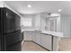 Bright kitchen with stainless steel appliances, white cabinetry and neutral countertops at 1908 Lake Atriums Cir # 3, Orlando, FL 32839