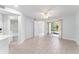 Living room with wood-look tile, patio access, and an open floor plan at 1908 Lake Atriums Cir # 3, Orlando, FL 32839
