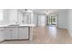Open-concept living area with wood-look flooring, plenty of natural light and sliding glass doors at 1908 Lake Atriums Cir # 3, Orlando, FL 32839