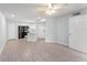 Open-concept living space featuring wood-look flooring and updated kitchen at 1908 Lake Atriums Cir # 3, Orlando, FL 32839