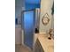 Contemporary bathroom featuring shower and vanity with stylish décor at 19430 Sw 100Th Loop, Dunnellon, FL 34432