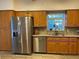 Spacious kitchen features stainless steel appliances and ample cabinet space at 19430 Sw 100Th Loop, Dunnellon, FL 34432
