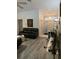 Modern living room with hardwood floors, leather seating, and white trim at 19430 Sw 100Th Loop, Dunnellon, FL 34432