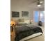 Comfortable main bedroom featuring neutral walls, ceiling fan, and inspirational wall art at 19430 Sw 100Th Loop, Dunnellon, FL 34432