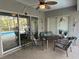 Relaxing covered patio overlooking pool and lush backyard at 19430 Sw 100Th Loop, Dunnellon, FL 34432