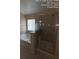 Bright bathroom with a glass-enclosed shower, soaking tub under a window, and modern fixtures at 226 Canna Dr, Davenport, FL 33897