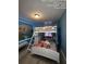 A charming bedroom with adorable Disney princess themed wallpaper and bunk beds at 226 Canna Dr, Davenport, FL 33897