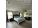 Bright bedroom features stylish decor, ceiling fan, and comfortable furniture at 226 Canna Dr, Davenport, FL 33897