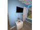 Cozy bedroom with bright blue walls and an adorable lit mural at 226 Canna Dr, Davenport, FL 33897