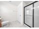 Bright bathroom featuring a walk-in shower with a glass enclosure, white tile and modern fixtures at 236 Miles Ct, Davenport, FL 33837