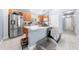 Modern kitchen featuring stainless steel appliances, ample counter space, and stylish tile flooring for cooking and dining at 236 Miles Ct, Davenport, FL 33837
