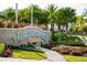 Margaritaville Resort sign surrounded by manicured landscaping, green grass, and a stone walkway at 2923 Castaway Ln, Kissimmee, FL 34747