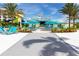 Outdoor bar and grill area with vibrant landscaping and seating, perfect for relaxation at 2923 Castaway Ln, Kissimmee, FL 34747