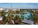 Expansive resort pool area, lush landscaping, with cabanas and a backdrop of resort buildings at 2923 Castaway Ln, Kissimmee, FL 34747