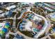 Aerial view of vibrant waterpark featuring waterslides, splash zones, and colorful amenities at 2923 Castaway Ln, Kissimmee, FL 34747