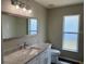 Bright bathroom with granite countertops, modern fixtures, and natural light at 307 Dalton Ct, Davenport, FL 33897