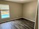 Bedroom with wood floors and a view of the pool at 307 Dalton Ct, Davenport, FL 33897