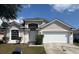 Charming single-Gathering home with a two-car garage and well-maintained lawn at 307 Dalton Ct, Davenport, FL 33897