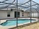Relaxing screened-in pool area with a well-maintained pool, great for outdoor enjoyment at 307 Dalton Ct, Davenport, FL 33897