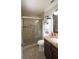 Bathroom with granite countertops, a glass shower and a modern white storage cabinet at 3223 Dragoon Pl, Orlando, FL 32818