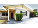 Charming front exterior featuring a covered porch and shuttered windows at 3223 Dragoon Pl, Orlando, FL 32818