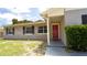 Charming front exterior featuring a covered porch and shuttered windows at 3223 Dragoon Pl, Orlando, FL 32818