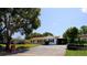 Charming single-story home featuring a well-maintained lawn and a spacious driveway, perfect for a growing Gathering at 3223 Dragoon Pl, Orlando, FL 32818