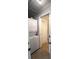 Efficient laundry space featuring a stacked washer and dryer unit and added storage cabinets at 3223 Dragoon Pl, Orlando, FL 32818