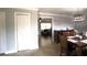 Comfortable living space featuring neutral walls and light tile flooring that connects seamlessly to the dining area at 3223 Dragoon Pl, Orlando, FL 32818