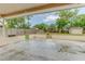 Back patio with shed and fenced yard featuring a concrete patio bordered by small decorative walls at 324 Sir Lawrence Dr, Sanford, FL 32773
