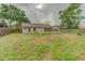 A spacious backyard with ample green space and a patio, ideal for outdoor activities and relaxation at 324 Sir Lawrence Dr, Sanford, FL 32773