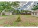Spacious backyard with a shed, mature trees, and a wooden fence providing privacy for outdoor enjoyment at 324 Sir Lawrence Dr, Sanford, FL 32773