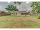 Large, fenced backyard featuring a patio perfect for outdoor entertaining or relaxation with ample green space at 324 Sir Lawrence Dr, Sanford, FL 32773