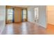 Spacious bedroom with wood floors and large windows and an ensuite bathroom with shower and closet at 324 Sir Lawrence Dr, Sanford, FL 32773