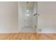 Bright foyer featuring tile entry way, hardwood style floors, and a white front door with a decorative window at 324 Sir Lawrence Dr, Sanford, FL 32773