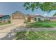 Charming single-story home featuring an attached two-car garage and neutral stucco exterior at 324 Sir Lawrence Dr, Sanford, FL 32773