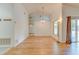 Bright living room with high ceilings, wood-look floors, and sliding glass doors that brings in natural light at 324 Sir Lawrence Dr, Sanford, FL 32773