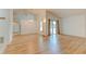 Bright living room with high ceilings, wood-look floors, and sliding glass doors that brings in natural light at 324 Sir Lawrence Dr, Sanford, FL 32773