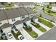Rear aerial view of the townhomes and garages, showing driveway parking at 3256 Merton Aly, Orlando, FL 32808