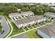 Neighborhood aerial view showcasing modern townhomes, green spaces, and well-manicured lawns at 3256 Merton Aly, Orlando, FL 32808