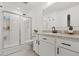 Clean bathroom features a glass-enclosed shower, vanity with white cabinets, and granite countertop at 3256 Merton Aly, Orlando, FL 32808
