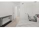 Minimalist bedroom with a large window and long console offers a peaceful and uncluttered space at 3256 Merton Aly, Orlando, FL 32808