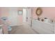 Charming bedroom with light pink walls and white dresser, perfect for relaxation and storage at 3256 Merton Aly, Orlando, FL 32808